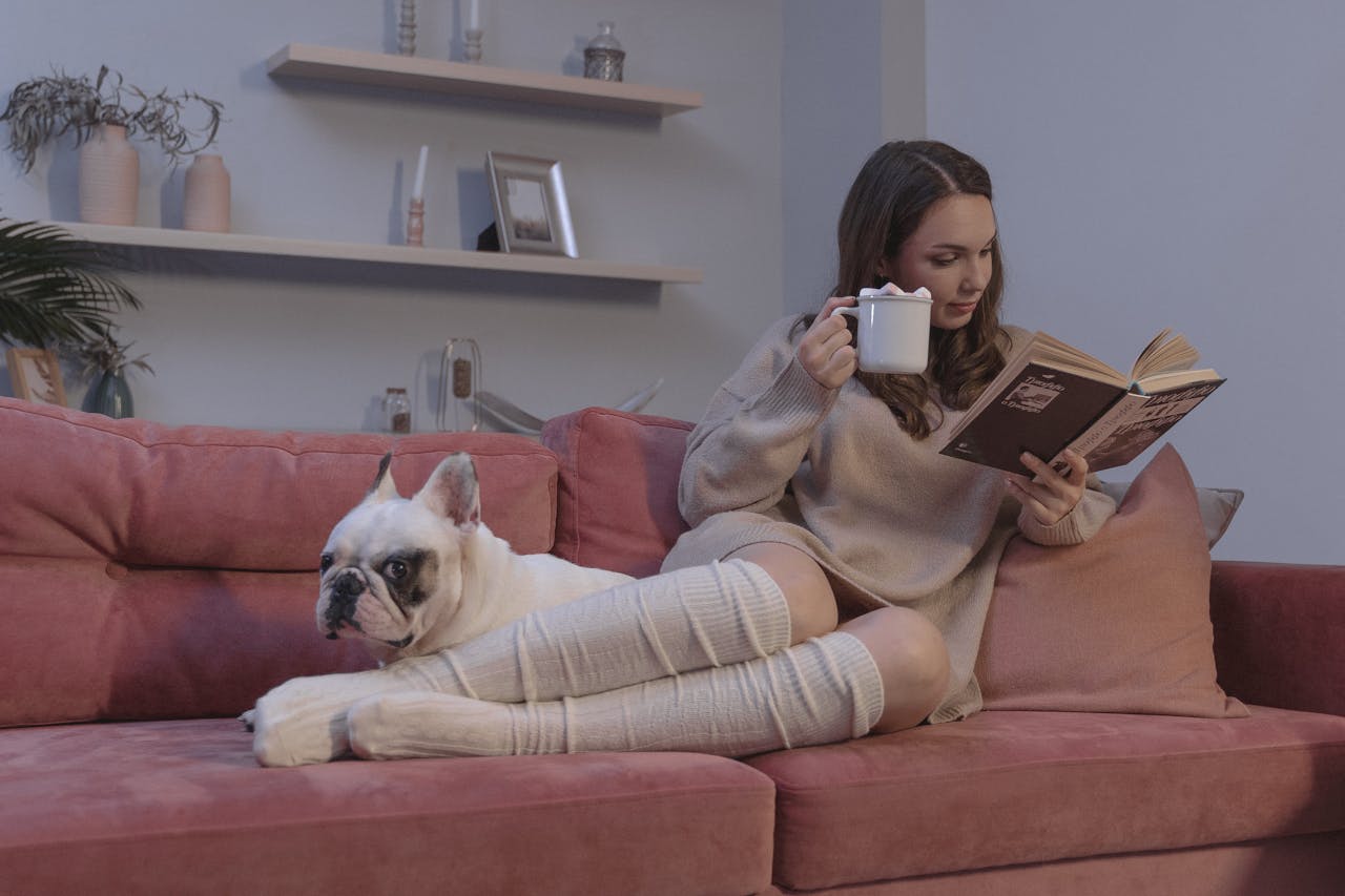 woman reading with dog